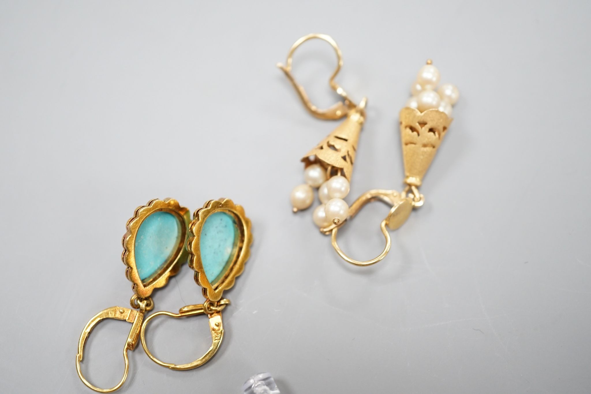 Two modern pairs of 18ct and gem set drop earrings, one with cultured pearl, 42mm and one with turquoise, gross weight 11.7 grams.